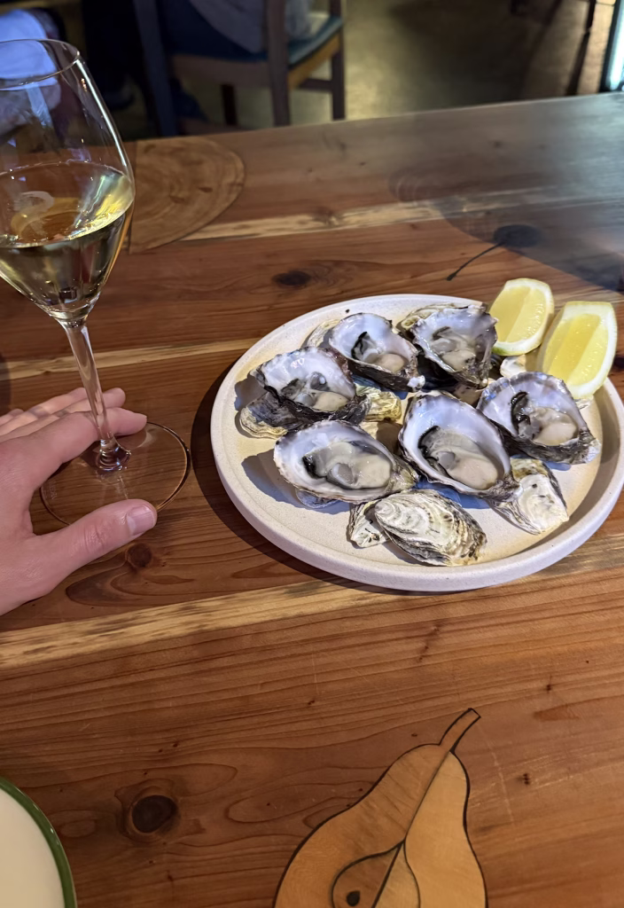 Oysters and a glass of wine at Fico in Hobart.